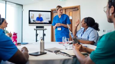 Medical staff meeting, with screen