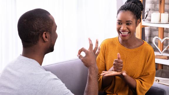 Two people having a sign language conversation.