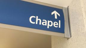 A sign reading "chapel", with an arrow.