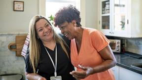 Carer laughing with patient