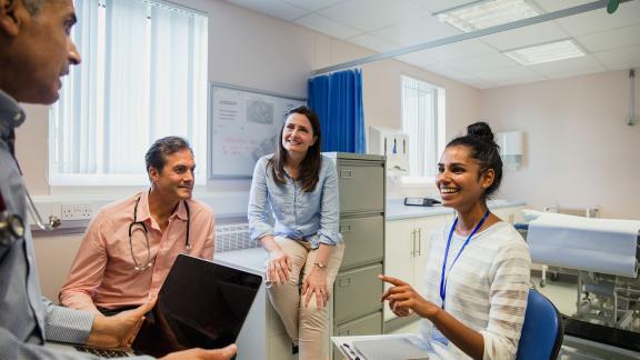 A diverse group of healthcare professionals in a meeting.