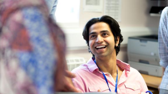 A healthcare professional, smiling.