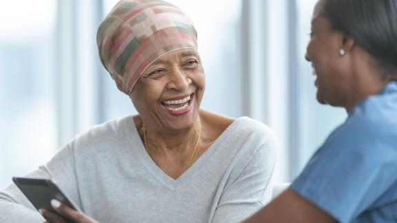 A patient laughing with a nurse.