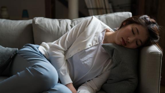 A woman sleeping on the sofa.