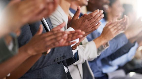 Delegates clapping - close up