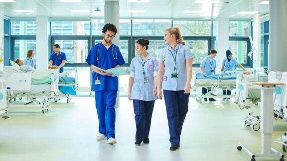 Medical staff walking on a ward